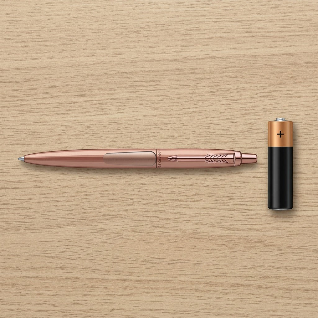 Scale reference: Parker Jotter XL Matte Rose Gold ballpoint pen shown next to a standard AA battery.