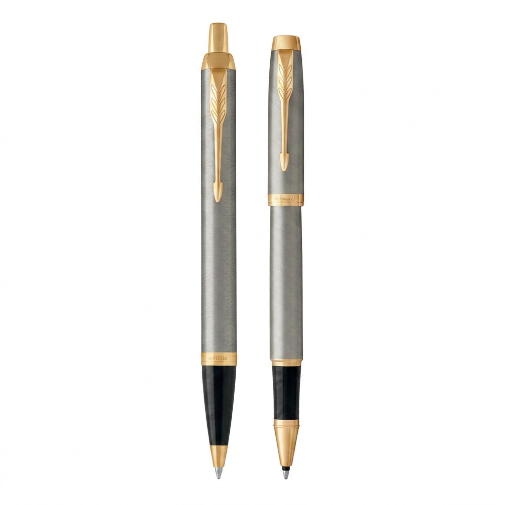 Parker IM Duo Pen Set: brushed metal ballpoint and rollerball pens with gold trim on white.