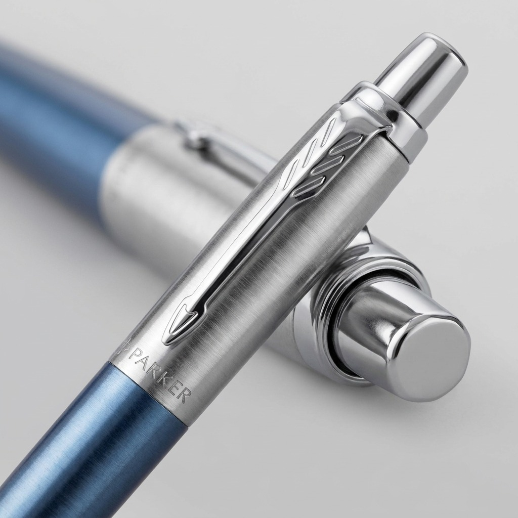 Macro detail of Waterloo Blue Parker Jotter pen showing engraved logo and iconic arrow clip.